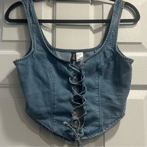 Woman’s cute denim lace up tank